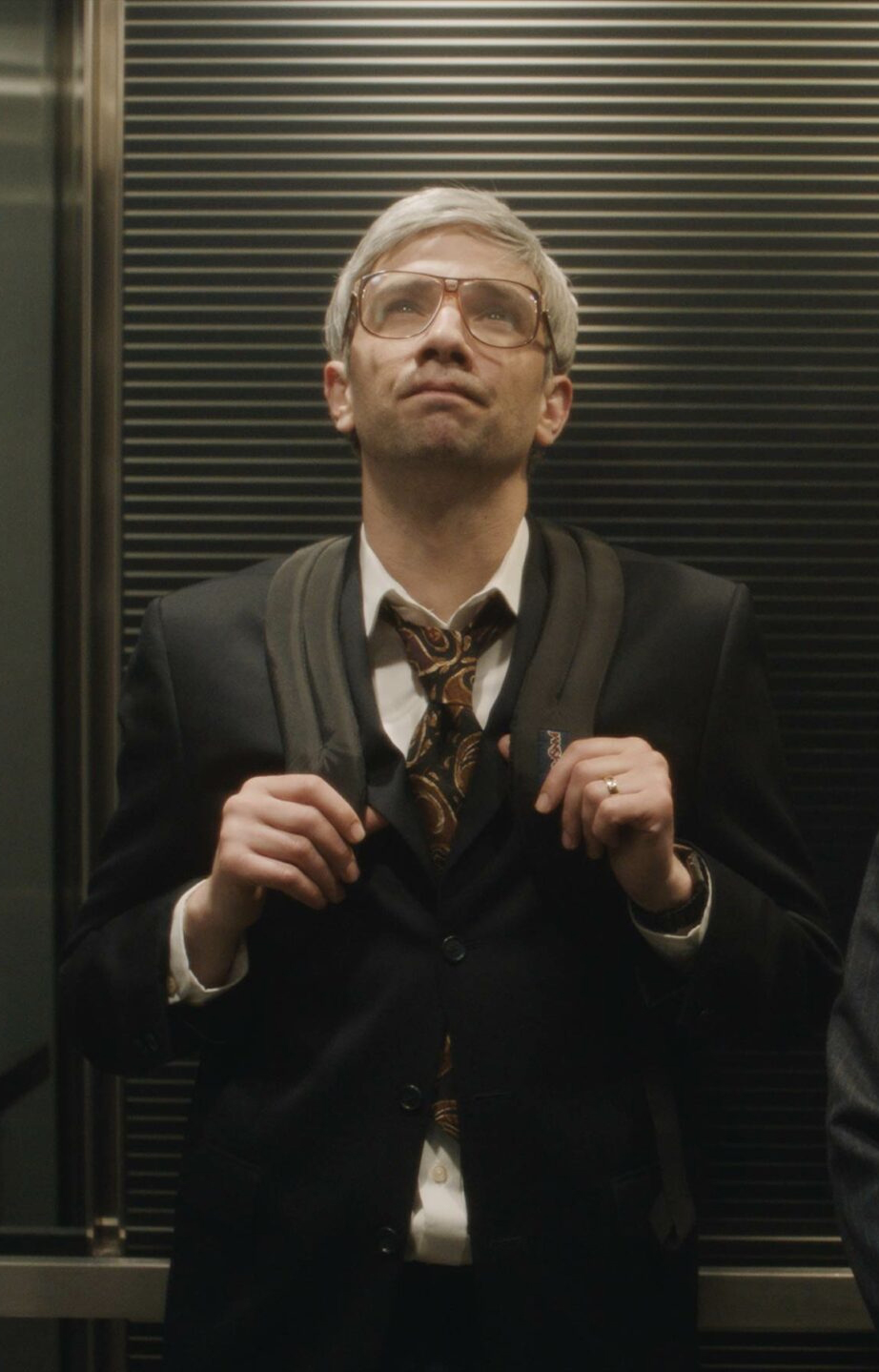 One men in elevator. Photo/image: ‘Blackberry’ courtesy of XYZ Films